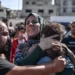 A woman holds her 3 year-old son who was killed by an Israeli strike on Gaza City.