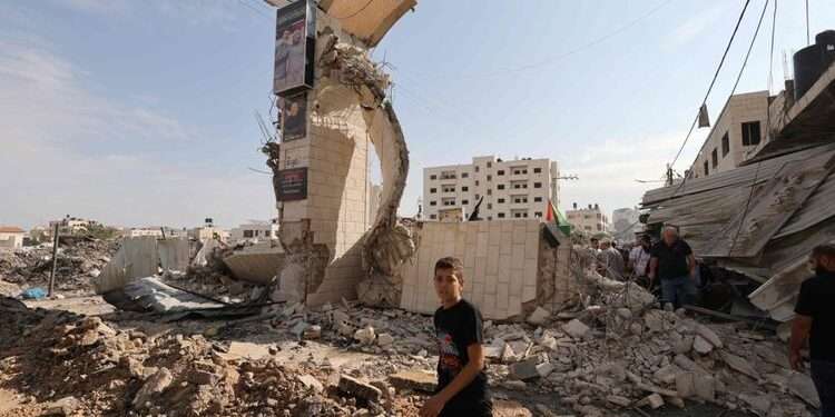 Raids Impale Occupied West Bank 1 Palestinians survey the destruction following an Israeli military raid on the Jenin Palestinian refugee camp, in Jenin in the West Bank on October 30, 2023.
