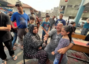 Palestinians react at the damages at a UN-run school sheltering displaced people, following an Israeli strike, in Jabalia.
