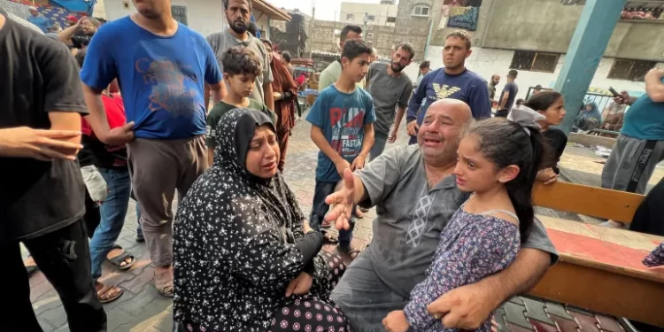 Israel Faces Criticism For Attack On Schools In Gaza 1 Palestinians react at the damages at a UN-run school sheltering displaced people, following an Israeli strike, in Jabalia.