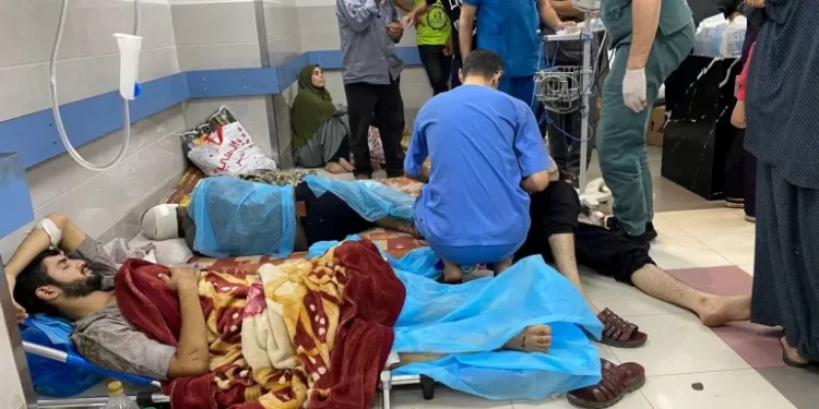 Palestinian wounded in an Israeli attack rest at Al-Shifa Hospital in Gaza City.