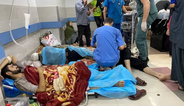 Contagious Diseases Spread As Gaza Health System Collapse 1 Palestinian wounded in an Israeli attack rest at Al-Shifa Hospital in Gaza City.