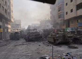 Israeli military vehicles manoeuvre in the Gaza Strip, as seen in a handout picture released by the Israeli army on November 13, 2023.