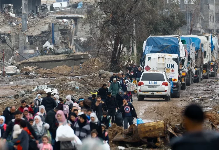 EU, NATO Urge For Israel-Hamas Truce To Be Extended 1 Palestinians fleeing north Gaza move southward as trucks carrying aid and fuel head towards north Gaza during a temporary truce between Israel and Hamas, near Gaza City.