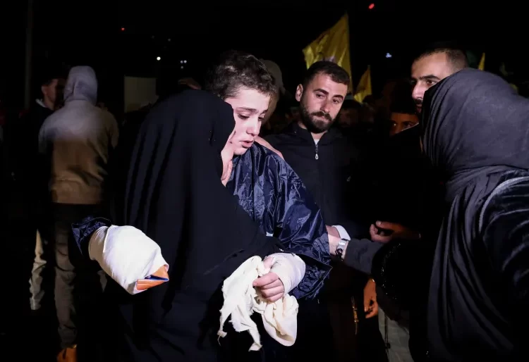 Civilians Prioritized For Release In Gaza 1 Palestinian child prisoner, Mohammed Nazza, hugs his mother after being released from an Israeli jail.
