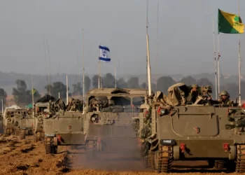 A convoy of Israeli tanks and armoured personnel carriers after leaving Gaza during the temporary truce.