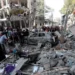Bahrain Severs Economic Ties With Israel 11 Palestinians inspect the damage of buildings that were hit by Israeli airstrikes, in the Shati refugee camp, Gaza City.