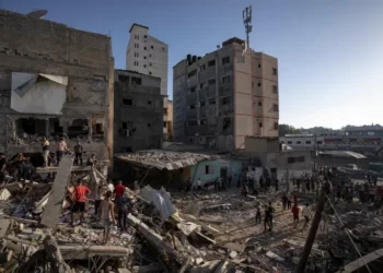 Palestinians search amid the destruction after Israeli attacks in Khan Younis on the Gaza Strip.