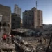 Palestinians search amid the destruction after Israeli attacks in Khan Younis on the Gaza Strip.
