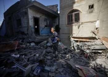 Palestinians inspect their destroyed houses in the town of Kazaa, eastern Khan Younis, on November 24, 2023.