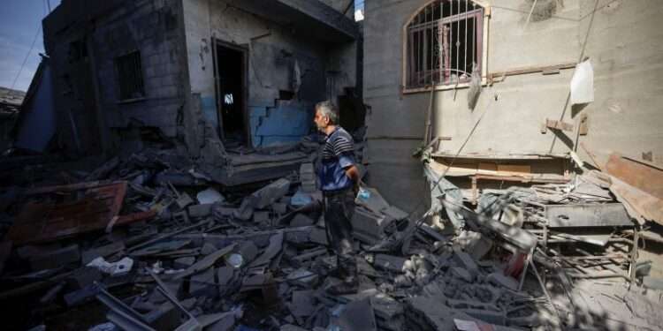 Palestinians inspect their destroyed houses in the town of Kazaa, eastern Khan Younis, on November 24, 2023.