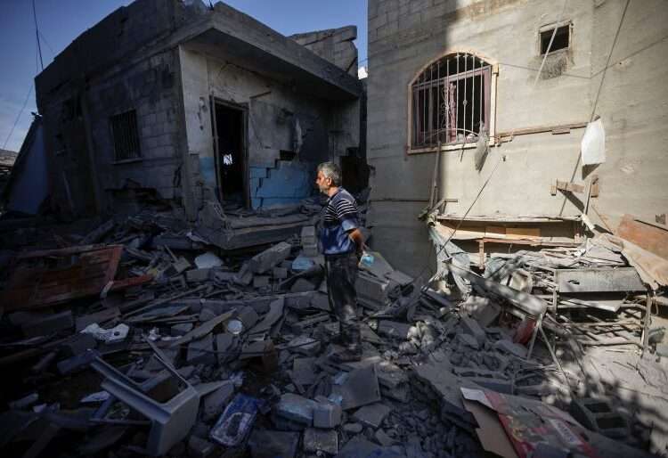 Palestinians inspect their destroyed houses in the town of Kazaa, eastern Khan Younis, on November 24, 2023.