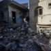 Palestinians inspect their destroyed houses in the town of Kazaa, eastern Khan Younis, on November 24, 2023.