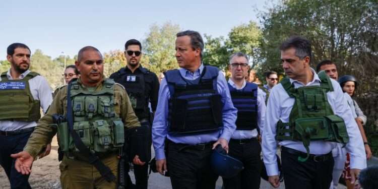 David Cameron Visits Israel 1 David Cameron (centre) and Eli Cohen (R) during the visit to Kibbutz Be’eri.