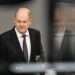 German Chancellor Olaf Scholz (L) addresses delegates at the Bundestag (lower house of parliament) about a budget crisis on November 28, 2023 in Berlin.