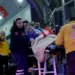 A Palestinian cancer patient, who had crossed from Gaza into Egypt, is carried on a stretcher after arriving at the Esenboga Airport in Ankara on November 16, 2023.