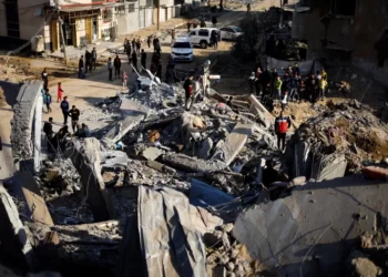 Palestinians gather at the site of an Israeli strike in Rafah, in the southern Gaza Strip.