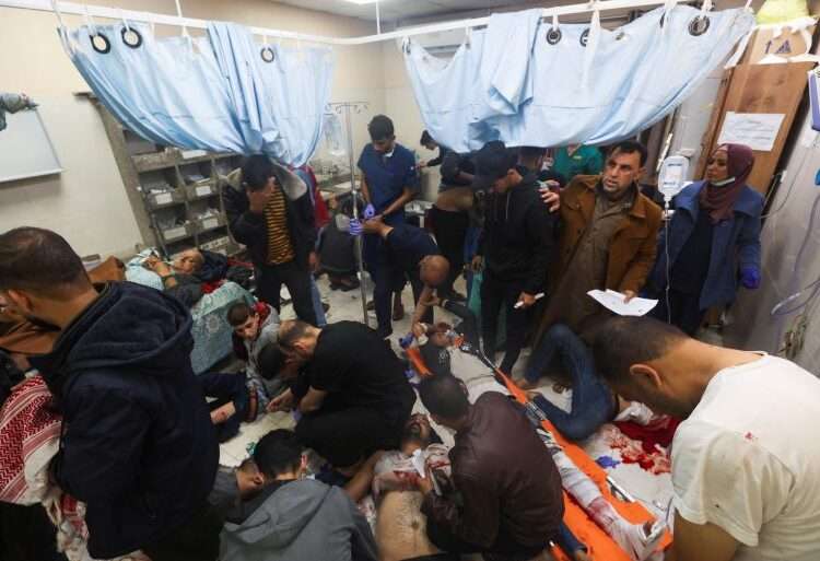 Israeli Allies' Reputation Marred By Civilian Deaths In Gaza 1 Wounded Palestinians are assisted at Nasser hospital, following Israeli strikes on Ma’an school east of Khan Younis, on Tuesday.