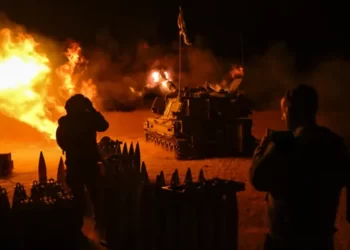 An Israel Defense Forces (IDF) artillery unit, using a self-propelled artillery howitzer, fires towards Gaza near the border in the Israel-Gaza war.