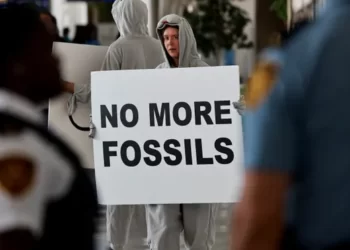 Activists attend a protest at the COP climate conference.