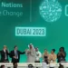 Cop28 president Sultan Ahmed Al Jaber, centre, hailed the adoption of the key text.
