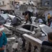 Palestinians inspect a house after it was hit by an Israeli bombardment on Rafah, southern Gaza Strip.