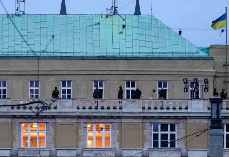 Police officers stand on the balcony of Philosophical Faculty of Charles University in Prague.