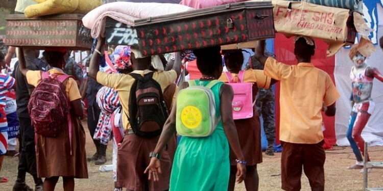 Some Students Carrying their Luggage to School