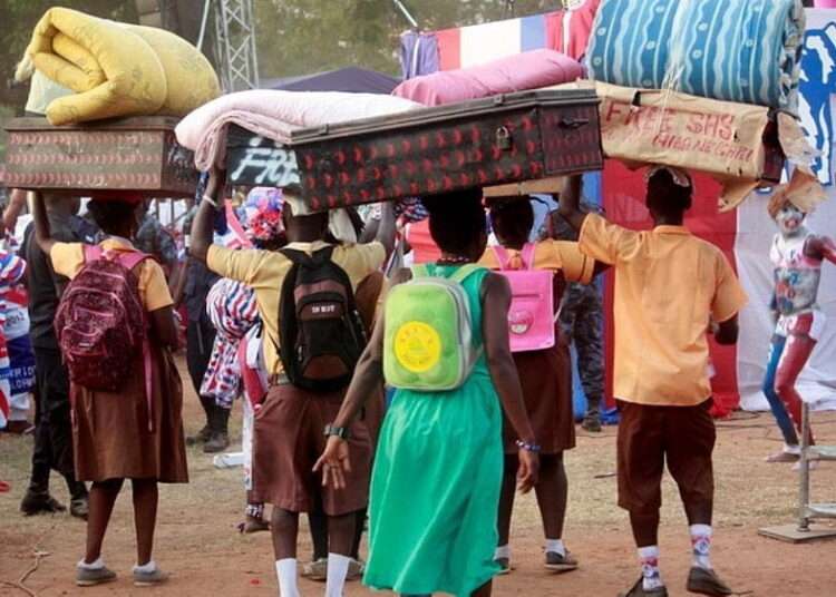 Some Students Carrying their Luggage to School