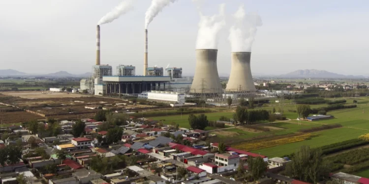 Guohua Power Station, a coal-fired power plant, operates in Dingzhou, Baoding, in the northern China’s Hebei province.