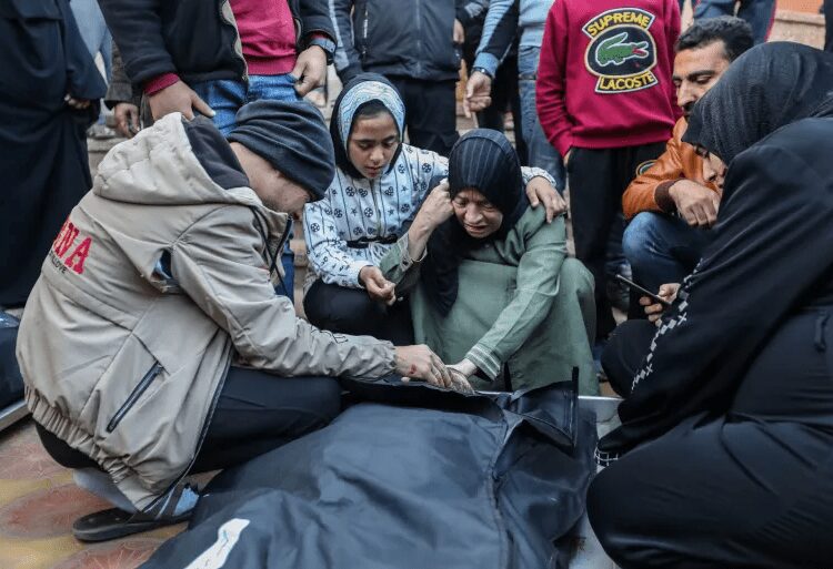 Israel Set To Obliterate Gaza's Health Sector 1 People mourn as they collect the bodies of Palestinians killed in an air strike in Khan Younis, Gaza.