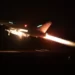 A missile is launched from a warship during a US-led coalition operation against Houthi targets in Yemen, from an undisclosed location, January 12, 2024.