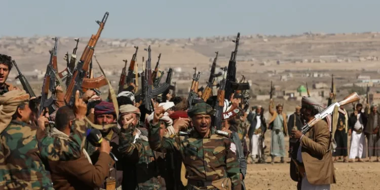 Houthi fighters and supporters protest against recent US-led strikes on Yemen.