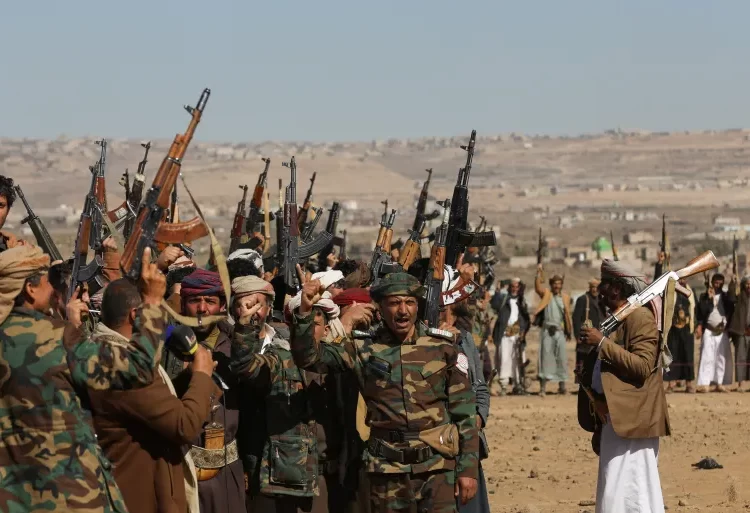 Houthis Announce Maritime Embargo Targeting Saudi Arabia 1 Houthi fighters and supporters protest against recent US-led strikes on Yemen.