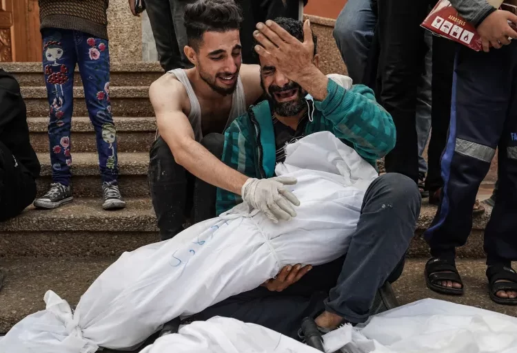 Palestinians mourn relatives killed in Israeli strikes at Nasser hospital in Khan Younis.