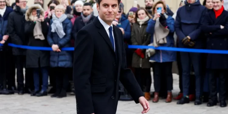 Newly-appointed French Prime Minister, Gabriel Attal arrives to attend a handover ceremony at the Hotel Matignon, French Prime Ministers' official residence, in Paris.