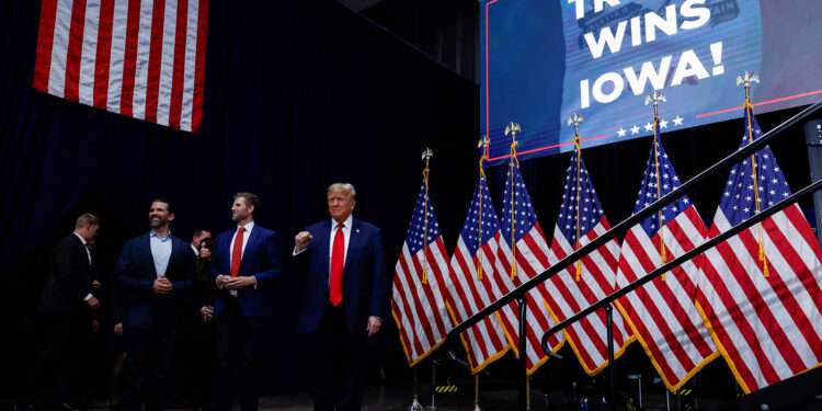 Republican presidential candidate and former U.S. President Donald Trump gestures during his Iowa caucus night watch party in Des Moines, Iowa.