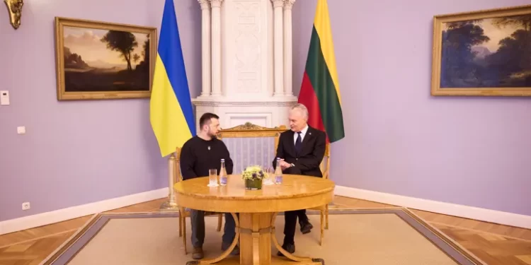 Lithuania’s President ,Gitanas Nauseda, right, talks with Ukrainian President Volodymyr Zelenskyy during their meeting in Vilnius, Lithuania.
