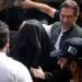 Imran Khan, Wife Get 14 Years Imprisonment 12 Imran Khan, right, with his wife Bushra Bibi appear in a court in Lahore.