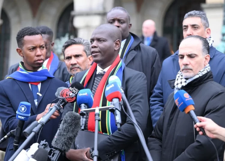 South Africa’s Justice Minister, Ronald Lamola (center)