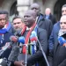 South Africa’s Justice Minister, Ronald Lamola (center)