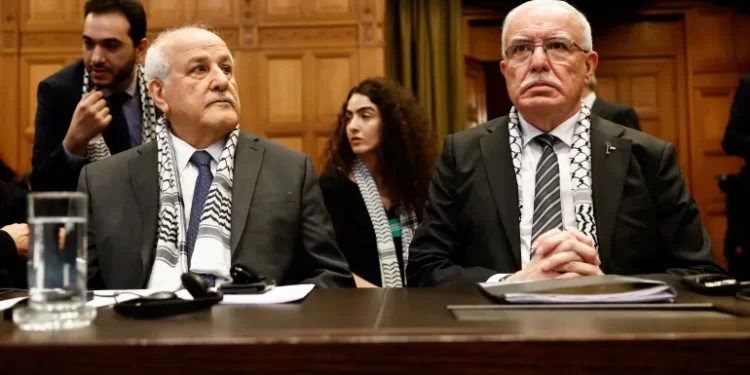Palestinian Foreign Minister Riyad al-Maliki and Palestinian U.N. envoy Riyad Mansour attend a public hearing held by The International Court of Justice (ICJ).