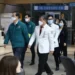 South Korean Prime Minister, Han Duck-soo, second from left, arrives for a meeting with doctors at National Police Hospital in Seoul, South Korea, Wednesday, Feb. 21, 2024.