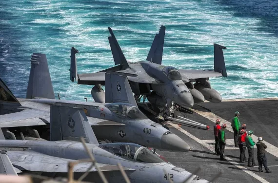 In this photo obtained from the US Department of Defense, US Navy F/A-18 Hornet multirole combat aircraft are pictured on the deck of the aircraft carrier USS Dwight D. Eisenhower, which according to the latest reports remains deployed in the Red Sea [US Department of Defense.