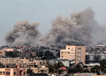 Smoke rises after buildings were attacked in southern Khan Younis city.