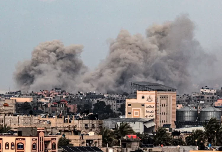 Gaza Situation Worse After ICJ Ruling 1 Smoke rises after buildings were attacked in southern Khan Younis city.