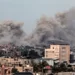 Smoke rises after buildings were attacked in southern Khan Younis city.