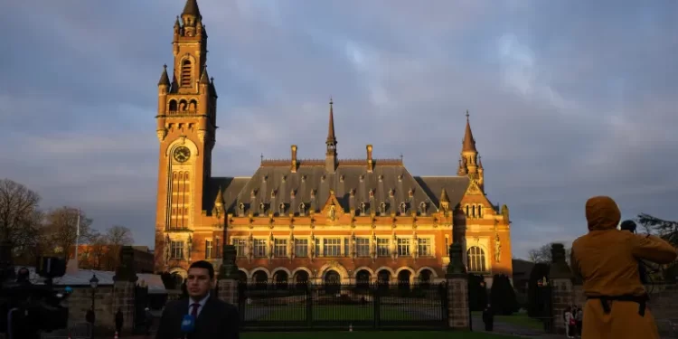 Journalists outside the Peace Palace, housing the ICJ in The Hague.