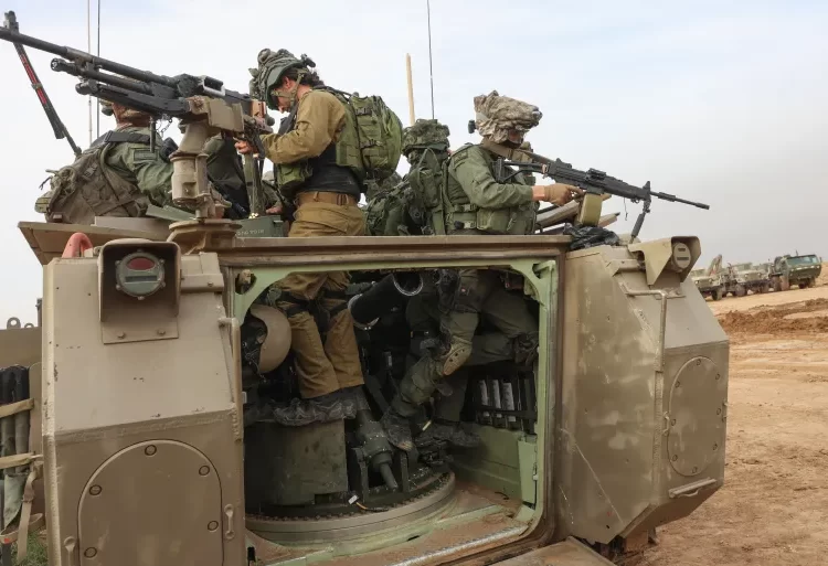 Criticism Against Israel's Imminent Ground Operations In Rafah Heightens 1 Israeli troops prepare weapons near Gaza.