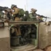 Israeli troops prepare weapons near Gaza.
